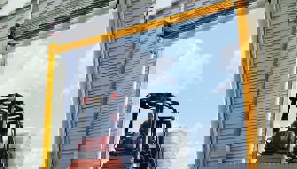 Height Restriction Barriers Protecting Warehouse Entrance from Forklift